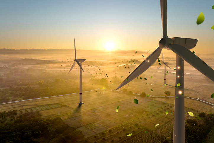 Wind Turbines Among Fields at Sunrise